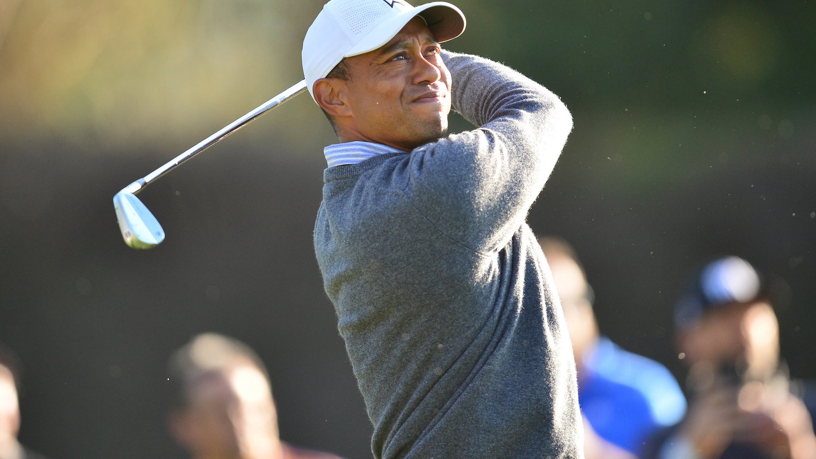 Tiger Woods goes FISHING for his golf ball in a trash can!